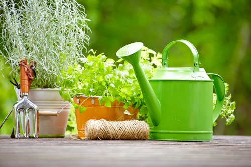 Green waste bins and labelled compost caddies in a sustainable gardening area